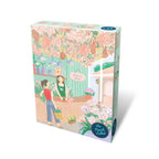 Puzzle box with floral design and two women in a garden setting