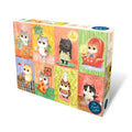 A 100-piece jigsaw puzzle box from The Puzzle Collab, featuring a colourful grid of cute cats in various cozy home scenes. Illustrated by artist Miss Wenly Illustration